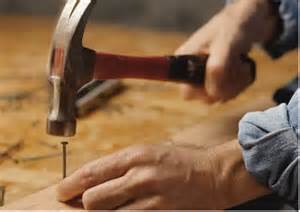 Man Hammering in a Nail (JPG)